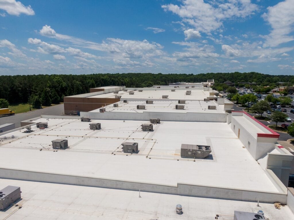 Drone Images of Commercial Roofs Featuring TPO and Asphalt Shingles: Midday, Sunny, No People tpo vs pvc roofing