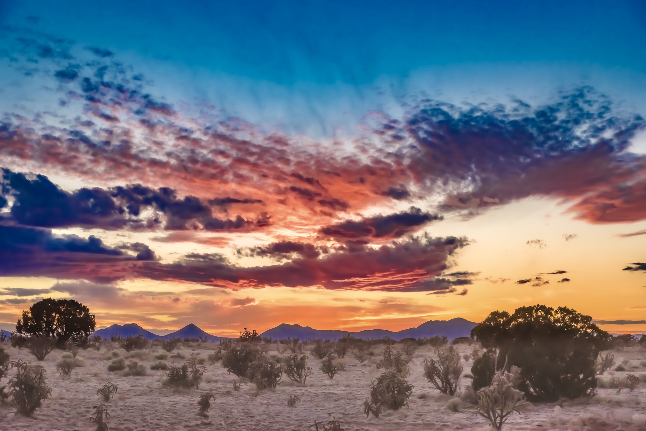 A beautiful sunset over a field in Santa Fe, New Mexico