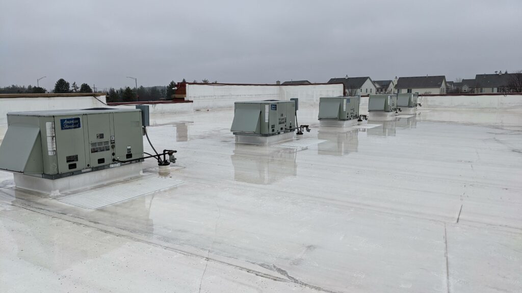 Rooftop units on a white reflective flat roof membrane in Albuquerque
