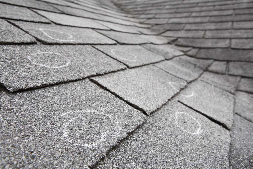 Roof with hail damaged shingles