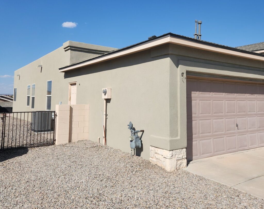 a beige house with stucco